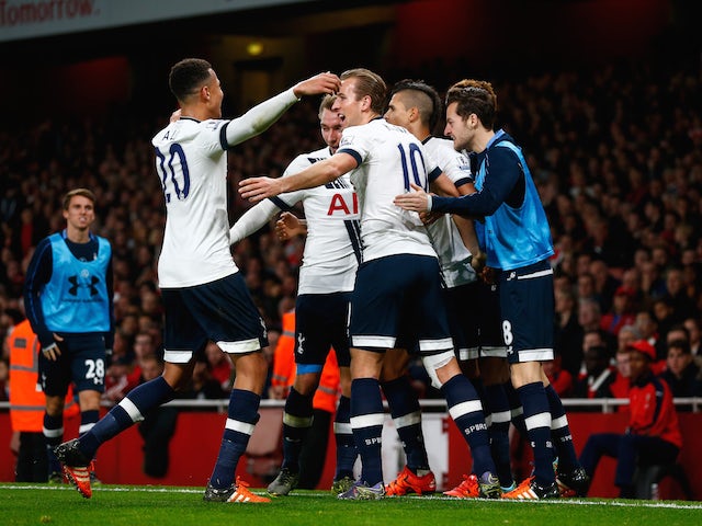 Harry Kane of Spurs (c) celebrates with his team mates after scoring his side's opening goal during the Barclays Premier League match between Arsenal and Tottenham Hotspur at the Emirates Stadium on November 8, 2015 in London, England.
