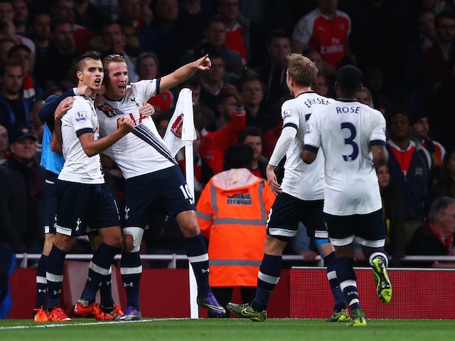 Harry Kane of Spurs (2L) celebrates with Erik Lamela of Spurs after scoring his side's opening goal during the Barclays Premier League match between Arsenal and Tottenham Hotspur at the Emirates Stadium on November 8, 2015 in London, England.