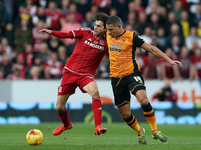 Jake Livermore of Hull City in action with Diego Fabbrini of Middlesbrough during the Sky Bet Championship match between Hull City and Middlesbrough at the KC Stadium on November 7, 2015 in Hull, England.