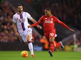 Jordon Ibe of Liverpool (r) holds off Damien Delaney of Crystal Palace during the Barclays Premier League match between Liverpool and Crystal Palace at Anfield on November 8, 2015 in Liverpool, England.