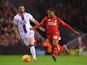 Jordon Ibe of Liverpool (r) holds off Damien Delaney of Crystal Palace during the Barclays Premier League match between Liverpool and Crystal Palace at Anfield on November 8, 2015 in Liverpool, England.