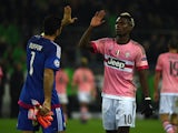 Juventus' goalkeeper Gianluigi Buffon and French midfielder Paul Pogba give high fives after the UEFA Champions League Group D, second-leg football match Borussia Moenchengladbach vs Juventus in Moenchengladbach, western Germany on November 3, 2015