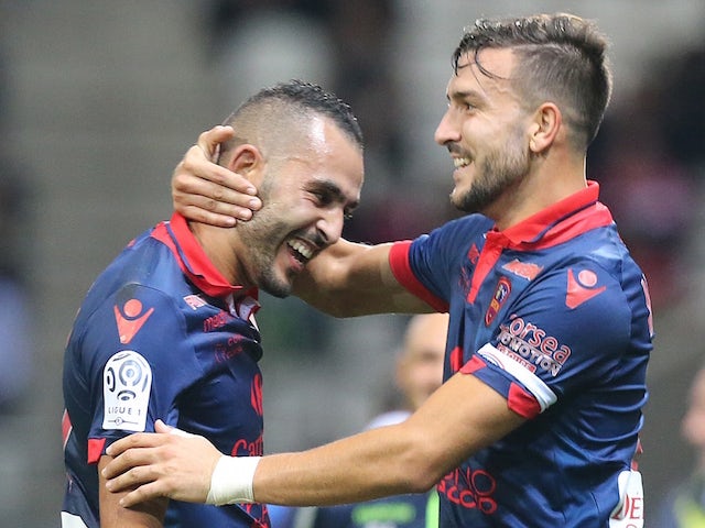 Ajaccio's French defender Pablo Martinez (R) congratulates his teammate French forward Khalid Boutaib after he scored a goal during the French L1 football match between Reims and Ajaccio on November 7, 2015 at the Auguste Delaune Stadium in Reims.