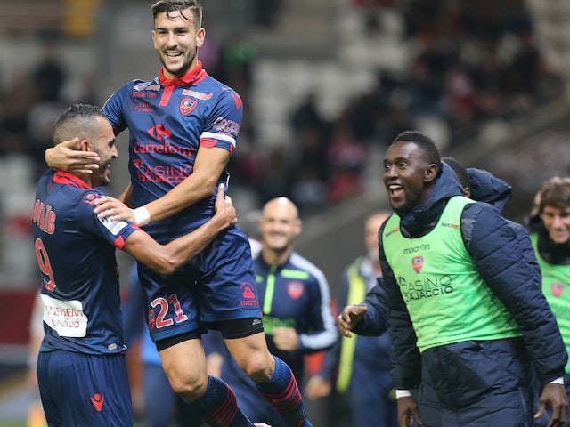 Ajaccio's French defender Pablo Martinez (2nd L) congratulates his teammate French forward Khalid Boutaib (L) after he scored a goal during the French L1 football match between Reims and Ajaccio on November 7, 2015 at the Auguste Delaune Stadium in Reims.