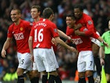 Cristiano Ronaldo of Manchester United celebrates with his team mates after scoring the opening goal; his 100th goal for Manchester United, during the Barclays Premier League match between Manchester United and Stoke City at Old Trafford on November 15, 2