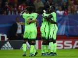 Wilfred Bony of Manchester City (2R) celebrates with team mates as he scores their third goal during the UEFA Champions League Group D match between Sevilla FC and Manchester City FC at Estadio Ramon Sanchez Pizjuan on November 3, 2015