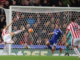 Stoke City's Austrian striker Marko Arnautovic (L) shoots to score the opening goal of the English Premier League football match between Stoke City and Chelsea at the Britannia Stadium in Stoke-on-Trent, central England on November 7, 2015.