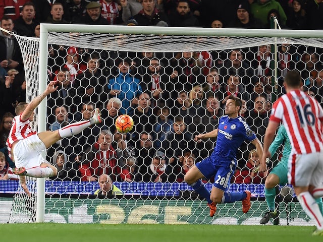 Stoke City's Austrian striker Marko Arnautovic (L) shoots to score the opening goal of the English Premier League football match between Stoke City and Chelsea at the Britannia Stadium in Stoke-on-Trent, central England on November 7, 2015.