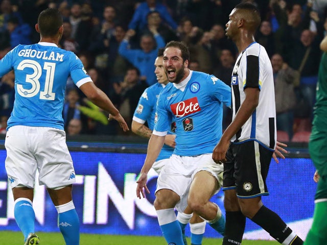 Napoli's Argentinian-French forward Gonzalo Higuain (C) celebrates after scoring during the Italian Serie A football match SSC Napoli vs Udinese Calcio on November 8, 2015