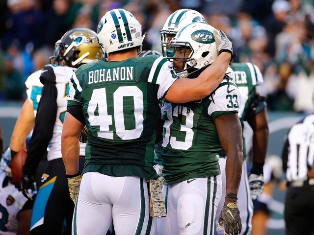 Chris Ivory #33 of the New York Jets is congratulated by his teammate Tommy Bohanon #40 after scoring a third quarter touchdown against the Jacksonville Jaguars Stadium on November 8, 2015