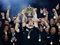 New Zealand's flanker and captain Richie McCaw (C) celebrates with the Webb Ellis Cup after winning the 2015 Rugby World Cup at Twickenham stadium, South-West London, on October 31, 2015