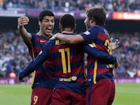 Barcelona's Brazilian forward Neymar da Silva Santos Junior (C) is congratulated by teammates Barcelona's Uruguayan forward Luis Suarez (L) and Barcelona's midfielder Sergi Roberto after scoring during the Spanish league football match FC Barcelona vs Vil