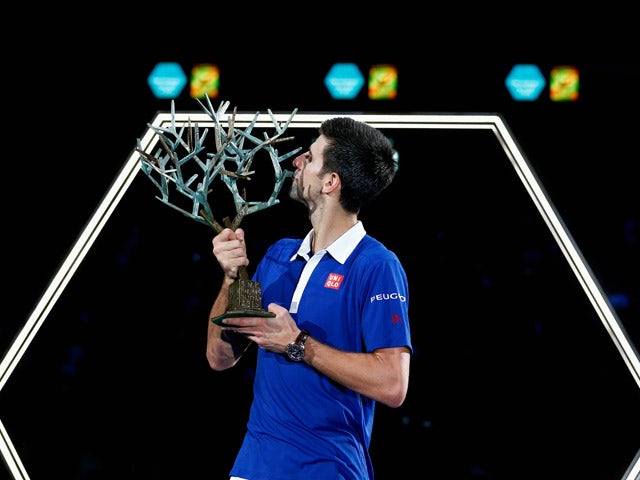 Novak Djokovic of Serbia poses with the trophy after victory against Andy Murray of Great Britain in their Mens Final match during Day 7 of the BNP Paribas Masters held at AccorHotels Arena on November 8, 2015