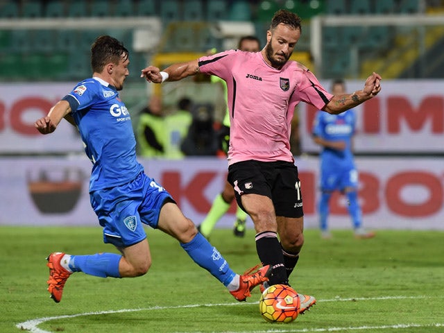 Alberto Gilardino (R) of Palermo is challenged by Silva Mario Rui of Empoli compete for the ball during the Serie A match between US Citta di Palermo and Empoli FC at Stadio Renzo Barbera on November 2, 2015