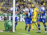 Porto's Portuguese midfielder Andre Andre (C) reacts after scoring during the UEFA Champions League, group G, football match between Maccabi Tel Aviv and FC Porto at the Sammy Ofer Stadium, in the Israeli coastal city of Haifa, on November 04, 2015