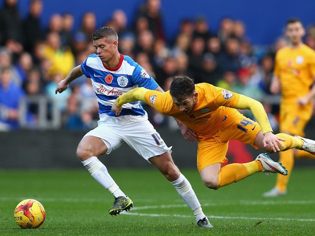 Joe Garner of Preston North End (R) is tackled by Paul Konchesky of QPR during the Sky Bet Championship match between Queens Park Rangers and Preston North End at Loftus Road on November 7, 2015 in London, United Kingdom.
