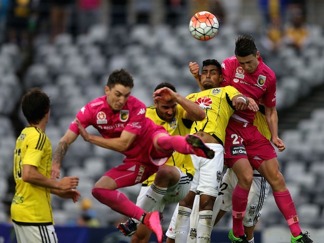 Roy Krishna of the Phoenix contests the header against Jake McGing of the Mariners during the round five A-League match between the Central Coast Mariners and the Wellington Phoenix at Central Coast Stadium on November 8, 2015 in Gosford, Australia.