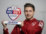 Morecambe striker Shaun Miller with October's League Two Player of the Month award