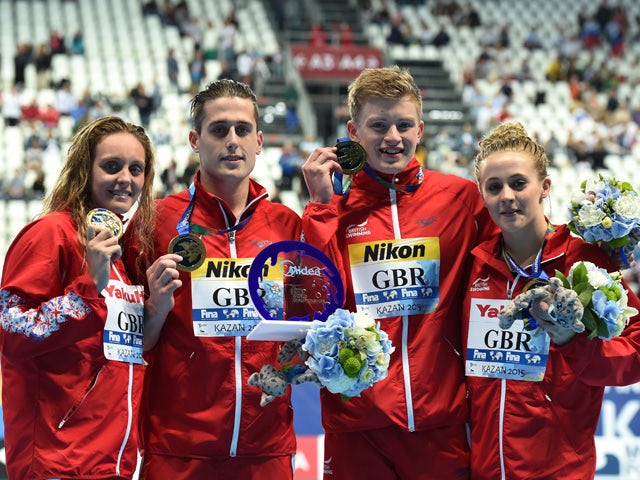 Fran Halsall, Chris Walker-Hebborn, Adam Peaty and Siobhan-Marie O'Connor of Great Britain pose during the medal ceremony for the Mixed 4x100m Medley Relay Final on day twelve of the 16th FINA World Championships at the Kazan Arena on August 5, 2015