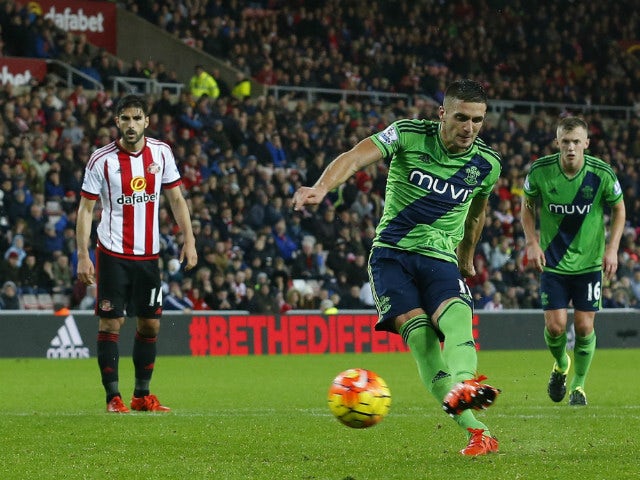 Southampton's Serbian midfielder Dusan Tadic (2nd R) scores the opening goal from the penalty spot during the English Premier League football match between Sunderland and Southampton at the Stadium of Light in Sunderland, north east England on November 7,