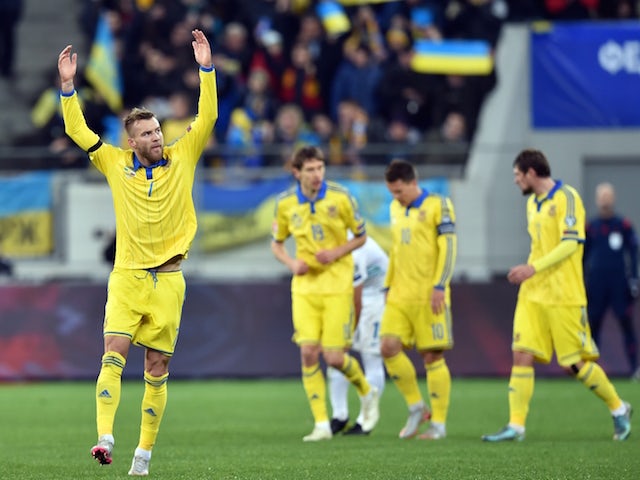 Ukraine's Andriy Yarmolenko (L) celebrates after scoring against Slovenia in the Euro 2016 play-off football match between Ukraine and Slovenia at the Arena Lviv stadium in Lviv on November 14, 2015.