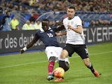 French defender Bacary Sagna (L) vies with Germany's defender Jonas Hector during a friendly international football match between France and Germany ahead of the Euro 2016, on November 13, 2015 at the Stade de France stadium in Saint-Denis, north of Paris