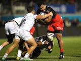 Billy Vunipola of Saracens is stopped by Julien Marchand during the European Rugby Champions Cup match between Saracens and Toulouse at Allianz Park on November 14, 2015 in Barnet, England.