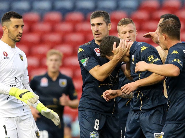 Mariners players celebrate during the round six A-League match between the Newcastle Jets and the Central Coast Mariners at Hunter Stadium on November 14, 2015