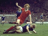 David Fairclough of Liverpool is tackled by an Everton player during a Football League Division One match at Anfield in Liverpool in Apirl, 1977