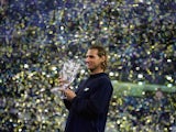 David Nalbandian of Argentina holds the trophy after his five set victory against Roger Federer of Switzerland in the final of the ATP Masters Cup on November 20, 2005 at the Qi Zhong Stadium in Shanghai, China. 