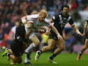 James Graham of England isheld up by Tohu Harris of New Zealand during the third International Rugby League Test Series match between England and New Zealand at DW Stadium on November 14, 2015