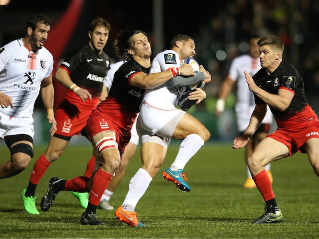 Luke McAlister of Toulouse takes on Michael Rhodes during the European Rugby Champions Cup match between Saracens and Toulouse at Allianz Park on November 14, 2015 in Barnet, England.