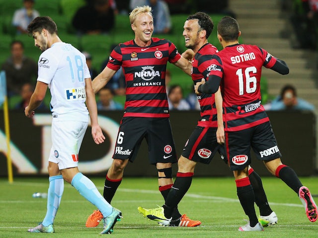 Mitch Nichols (L) of the Wanderers celebrates a goal by Mark Bridge of the Wanderers (C) during the round six A-League match between Melbourne City FC and the Western Sydney Wanderers at AAMI Park on November 13, 2015 in Melbourne, Australia. 