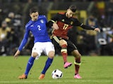 Italy's Mattia De Sciglio (L) vies for the ball with Belgium's midfielder Yannick Carrasco (R) during the friendly football match between Belgium and Italy, at the King Baudouin Stadium, on November 13, 2015 in Brussels.