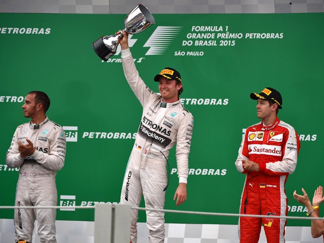 Mercedes' Formula One German driver Nico Rosberg (C) celebrates after winning the Brazilian Grand Prix, at the Interlagos racetrack in Sao Paulo, on November 15, 2015