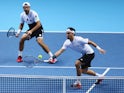 Simone Bolelli (L) and Fabio Fognini of Italy in action in their men's doubles match against Jamie Murray of Great Britain and John Peers of Australia during day one of the Barclays ATP World Tour Finals at O2 Arena on November 15, 2015 in London, England