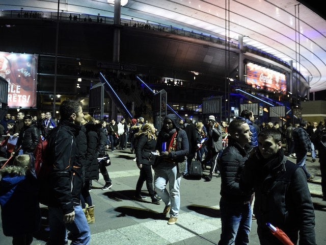 Spectators begin to leave the Stade de France on November 13, 2015