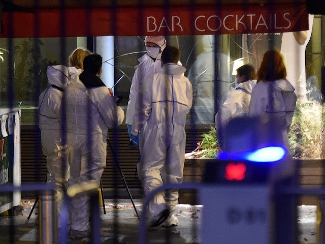 Forensic specialists arrive at the Stade de France on November 13, 2015