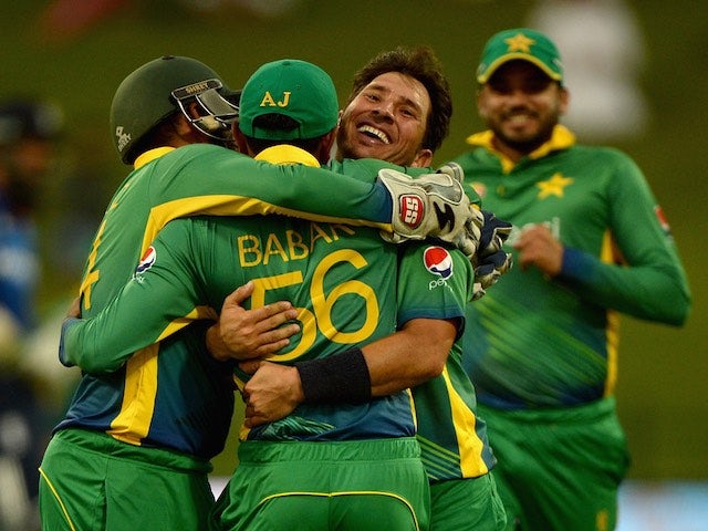 Pakistan celebrate an England wicket during the first one-day international in Abu Dhabi on November 11, 2015