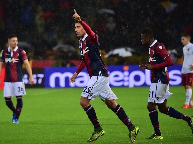 Bologna's defender from Morocco Adam Masina (C) celebrates with teammates after scoring during the Italian Serie A football match Bologna vs AS Roma on November 21, 2015 at the Renato Dall'Ara stadium in Bologna. 