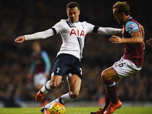 Dele Alli of Tottenham Hotspur takes on Mark Noble of West Ham United during the Barclays Premier League match between Tottenham Hotspur and West Ham United at White Hart Lane on November 22, 2015 in London, England.
