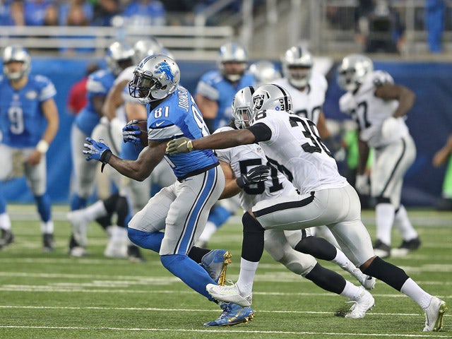 Calvin Johnson #81 of the Detroit Lions make a first down catch during the second quarter of the game against the Oakland Raiders on November 22, 2015