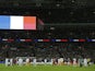 England and France squad members observe a minute's silence before the start of the friendly football match between England and France at Wembley Stadium in west London on November 17, 2015