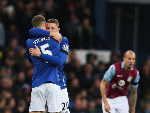 Ross Barkley (C) of Everton celebrates scoring his team's first goal with his team mate John Stones (L) during the Barclays Premier League match between Everton and Aston Villa at Goodison Park on November 21, 2015