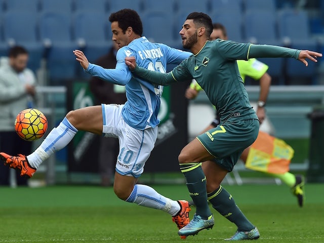 Lazio's midfielder from Brazil Felipe Anderson (L) vies with Palermo's defender from Morocco Achraf Lazaar during the Italian Serie A football match between SS Lazio and Palermo on November 22, 2015 at the Olympic stadium in Rome.