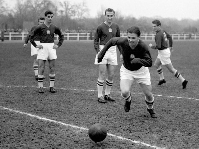 A file picture taken 21 November 1953 shows Hungarian football legend Ferenc Puskas (C) training with French car maker Renault workers in the western Paris suburb of Boulogne-Billancourt ahead of the match opposing Hungary to England at Wembley