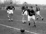 A file picture taken 21 November 1953 shows Hungarian football legend Ferenc Puskas (C) training with French car maker Renault workers in the western Paris suburb of Boulogne-Billancourt ahead of the match opposing Hungary to England at Wembley