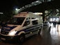 Police survey the entrance of the stadium as supporters leave the HDI Arena after the friendly football match Germany vs the Netherlands was called off for 'security reasons' in Hannover on November 17, 2015