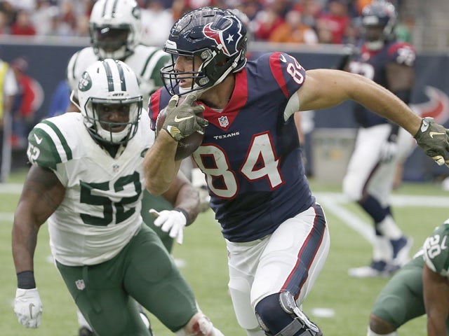 Ryan Griffin #84 of the Houston Texans runs against David Harris #52 of the New York Jets in the second quarter on November 22, 2015