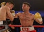 Lee Haskins of Great Britain and Ryosuke Iwasa of Japan exchange blows during their Interim IBF World Bantamweight Title Fight at Action Indoor Sports Arena on June 13, 2015 in Bristol, England.